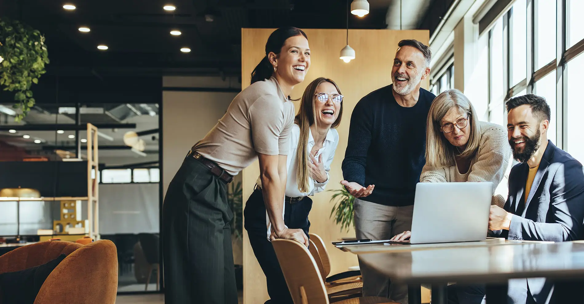 Photo by iStock, a team of employees working on a project.